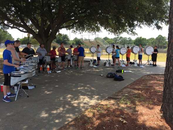 Michael helping teach the University of Texas at Arlington drum line in August 2015